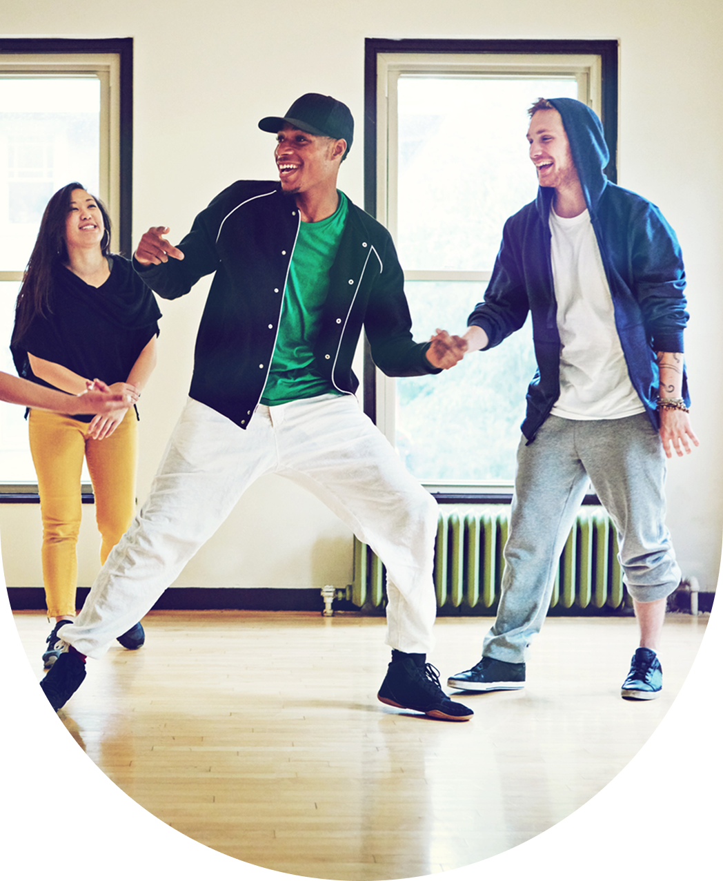 People dancing and laughing in a studio.